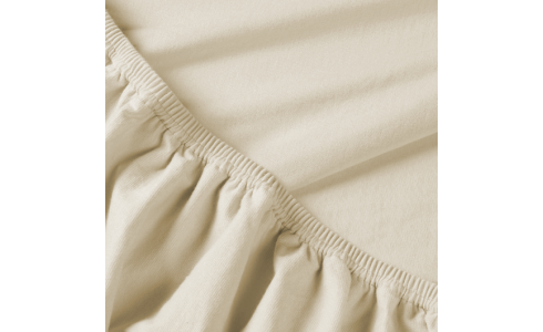 Rebeka elasztikus jersey lepedő panna cotta színben, kitűnő minőségű pamutból, körben gumis rögzítéssel.